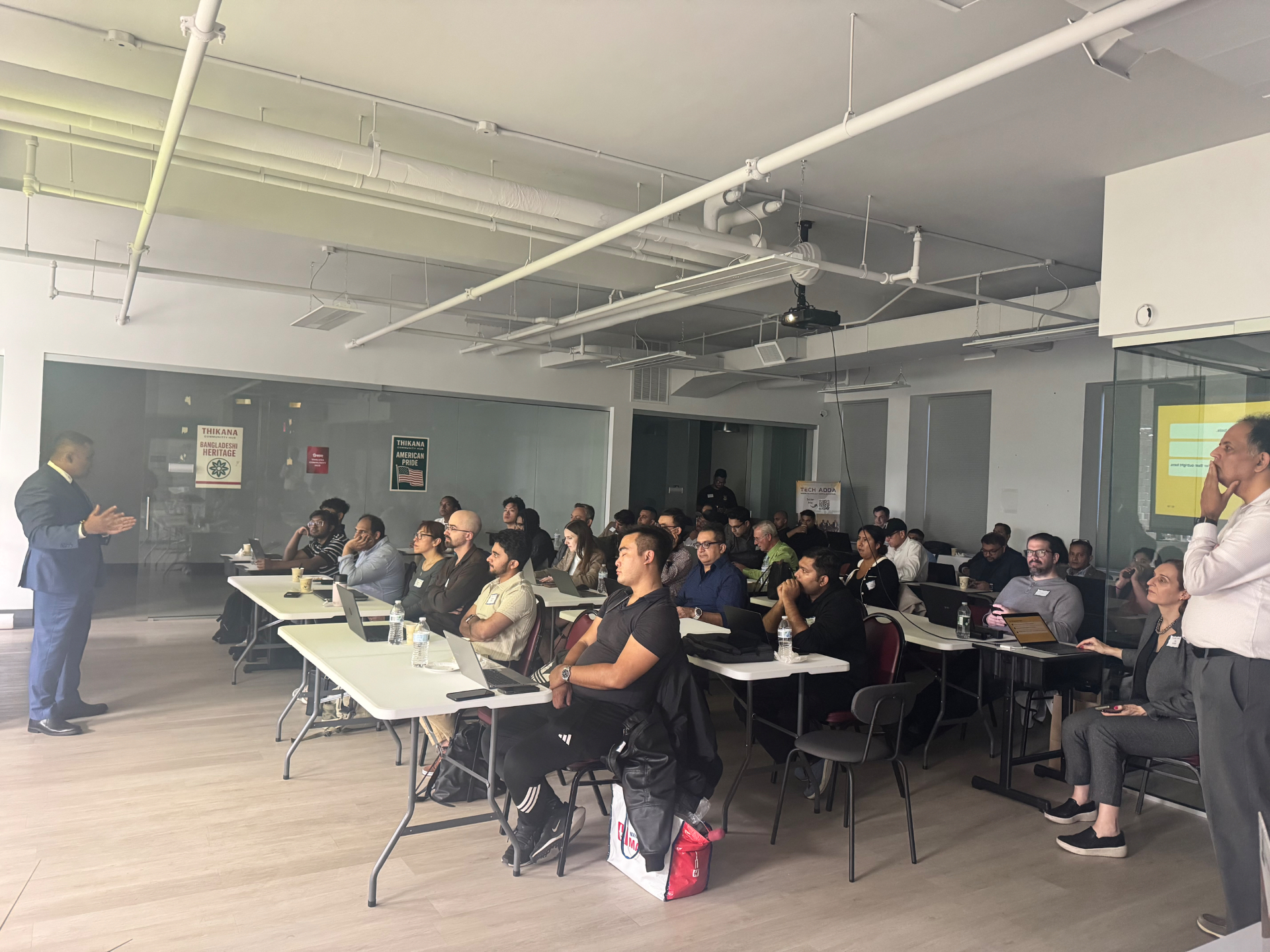 Trainer speaking to a full AI class