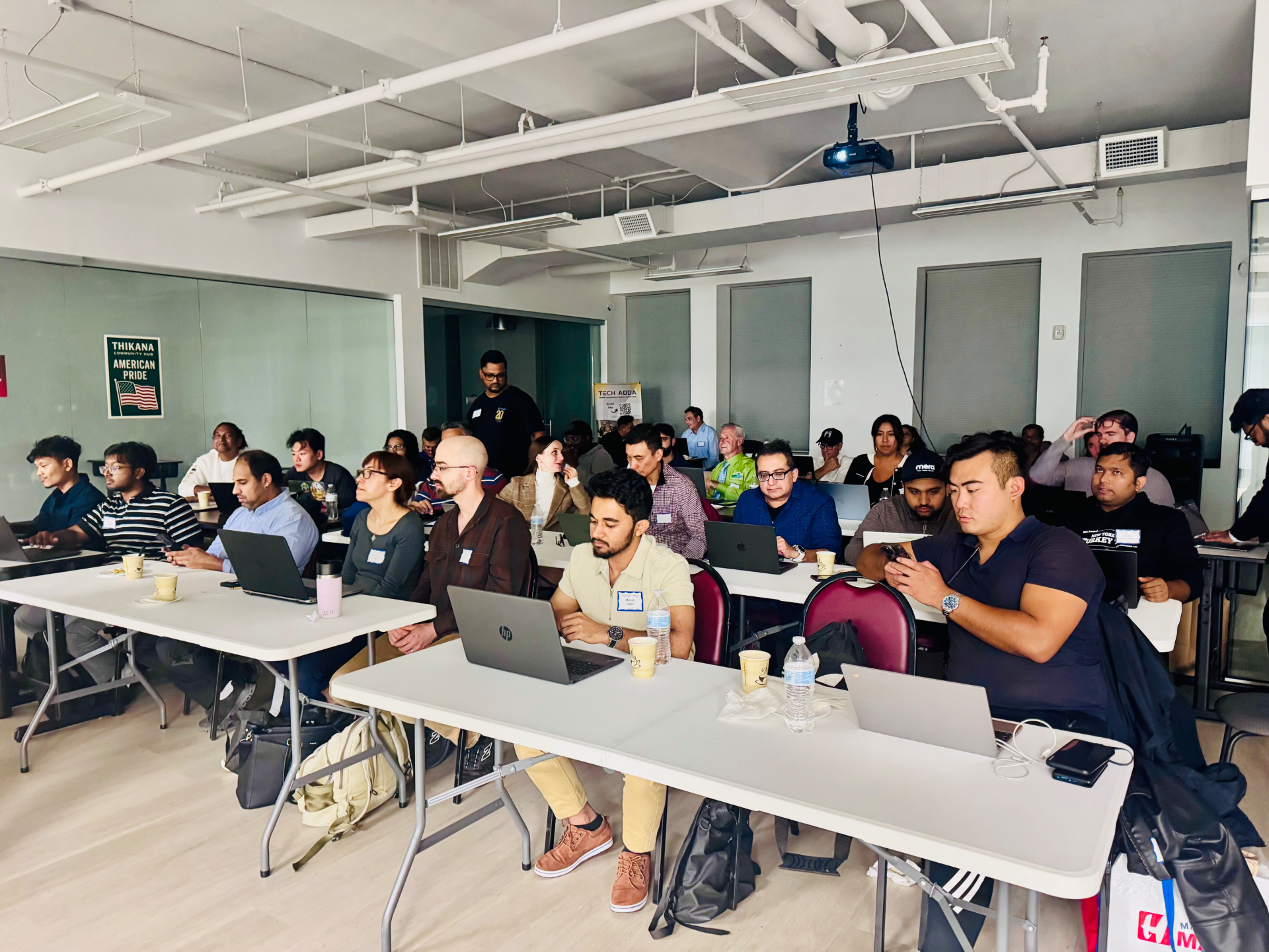 Attendees following along at an AI workshop